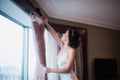 Beautiful girl tries on a pink wedding dress Royalty Free Stock Photo