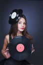 Beautiful girl with vinil disc on black background Royalty Free Stock Photo