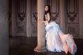 Beautiful girl in a vintage dress, in gloomy interior, Gothic and fairy tale