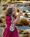 Beautiful girl in vintage red dress with a rose Royalty Free Stock Photo