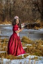 Beautiful girl in vintage red dress with a rose Royalty Free Stock Photo