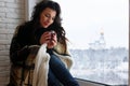 beautiful girl waiting for love sitting on the windowsill wrappe Royalty Free Stock Photo