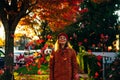 Beautiful girl walking outdoors in autumn. Young woman enjoying autumn weather Royalty Free Stock Photo