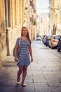 Beautiful girl wandering through Cagliari streets in Sardinia