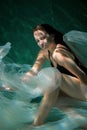 Young Slender Girl Underwater with a Cloth. Water Magic. Underwater Photography. Art Royalty Free Stock Photo