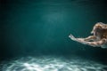 Young Slender Girl Underwater with a Cloth. Water Magic. Copy Space Royalty Free Stock Photo