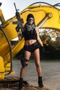 Beautiful girl with weapon and mask Royalty Free Stock Photo