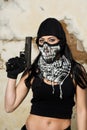 Beautiful girl with weapon and mask Royalty Free Stock Photo