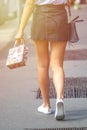 Beautiful girl wearing black mini dress and walking on Milan cit Royalty Free Stock Photo