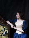 Beautiful girl wearing a medieval dress. XVII