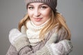 Beautiful girl wears winter scarf and mittens Royalty Free Stock Photo