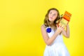 Beautiful girl in white dress holding a present in her hands Royalty Free Stock Photo