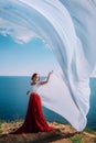 Beautiful Girl With White fabric on sea background Royalty Free Stock Photo