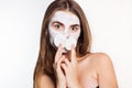 Beautiful girl with white face pack and cotton pad Royalty Free Stock Photo