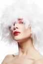 Beautiful Girl in white feathers. Beauty Make-up Royalty Free Stock Photo