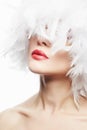 Beautiful Girl in white feathers. Beauty Make-up Royalty Free Stock Photo