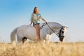 Beautiful girl with white horse in field Royalty Free Stock Photo