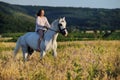 Beautiful girl with white horse in field Royalty Free Stock Photo