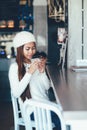 Beautiful girl in white outfit drinking Martini in a bar Royalty Free Stock Photo