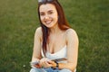 Girl sitting in a university campus use a tablet