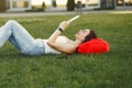 Girl sitting in a university campus use a tablet