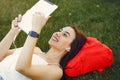 Girl sitting in a university campus use a tablet