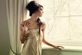 Beautiful girl by window Royalty Free Stock Photo