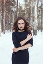 Beautiful girl in winter forest