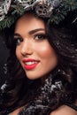 Beauty Fashion Model over Holiday. Beautiful girl with winter wreath. Royalty Free Stock Photo