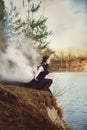 Beautiful girl witch conjures in the woods. Royalty Free Stock Photo