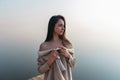 Beautiful girl on wooden pier near the water Royalty Free Stock Photo