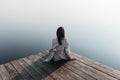 Beautiful girl on wooden pier near the water Royalty Free Stock Photo