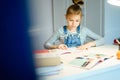 Beautiful girl working on her school project at home, education concept Royalty Free Stock Photo