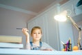 Beautiful girl working on her school project at home, education concept Royalty Free Stock Photo