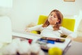 Beautiful girl working on her school project at home Royalty Free Stock Photo