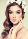 Beautiful girl with a wreath of flowers on her head. Royalty Free Stock Photo