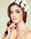 Beautiful girl with a wreath of flowers on her head. Royalty Free Stock Photo