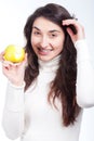 Beautiful girl with a yellow apple