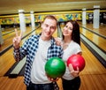 Beautiful girl and young man at the bowling alley Royalty Free Stock Photo