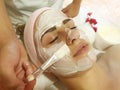 Beautiful girl, mask cosmetic in spa salon skincare cosmetology procedure, relaxation young