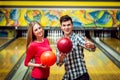 Beautiful girl and young man at the bowling alley Royalty Free Stock Photo