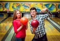 Beautiful girl and young man at the bowling alley Royalty Free Stock Photo