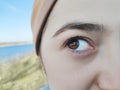 Beautiful girlish eye of hazel color. Girl unpainted, natural