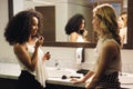 Beautiful Girls As Happy Friends Talking For Gossip In Restroom Royalty Free Stock Photo