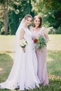 Beautiful girls Bride and bridesmaid with bouquets Royalty Free Stock Photo