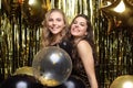 Beautiful girls celebrating New Year. Gorgeous smiling young women enjoying party celebration, having fun together