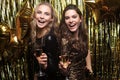 Beautiful girls celebrating New Year. Gorgeous smiling young women enjoying party celebration, having fun together