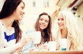 Beautiful girls drinking coffee in cafe Royalty Free Stock Photo