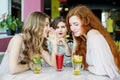 Beautiful girls gossip about their colleague. The concept of lifestyle, gossip, lies, friendship Royalty Free Stock Photo