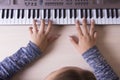 Beautiful girls hands playing electronic piano keyboards. Royalty Free Stock Photo